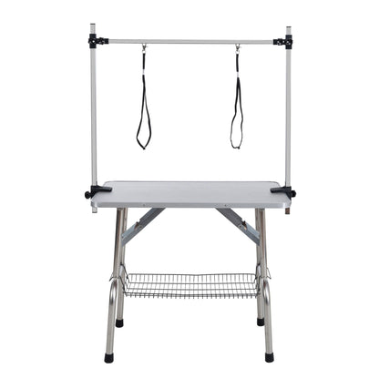 Mesa de aseo plegable para perros y gatos con marco de acero inoxidable y alfombrilla de goma integrada, brazo ajustable y abrazaderas.