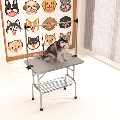 Mesa de aseo plegable para perros y gatos con marco de acero inoxidable y alfombrilla de goma integrada, brazo ajustable y abrazaderas.